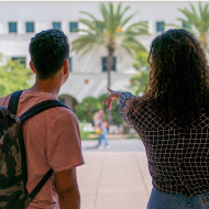 Two students pointing