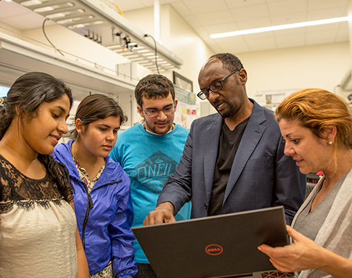 Students and professor in lab.
