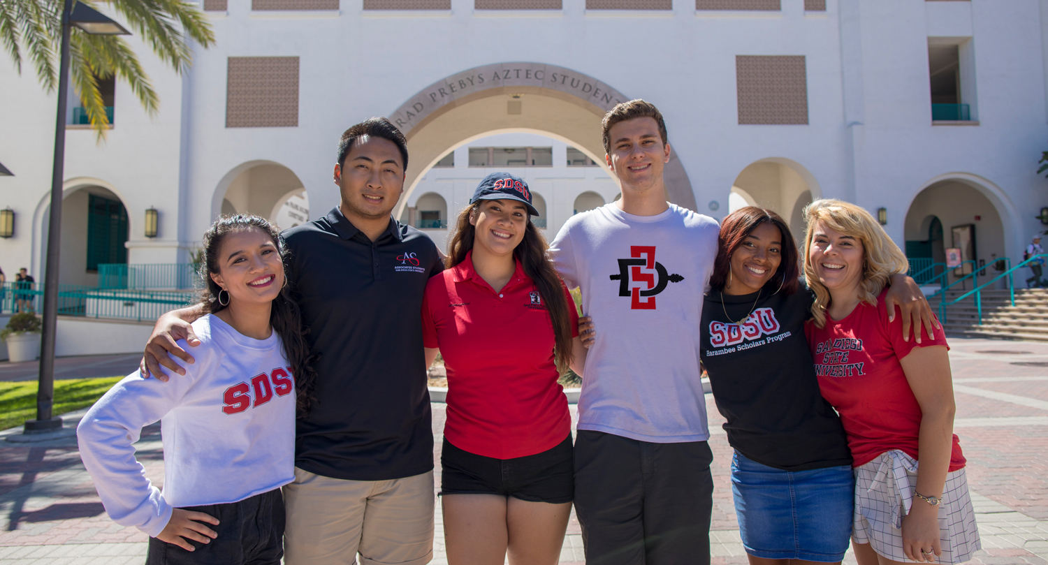 Group of students in from of Conrad Preby's Aztec Student Union.